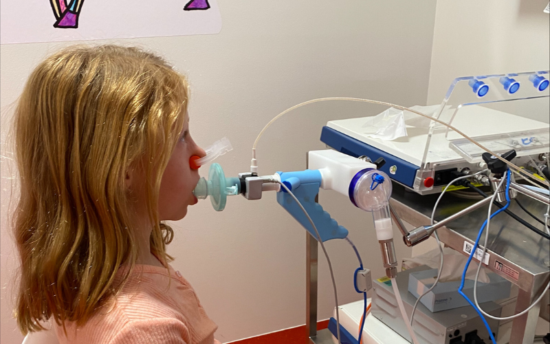 Nine-year-old Holly doing lung function tests