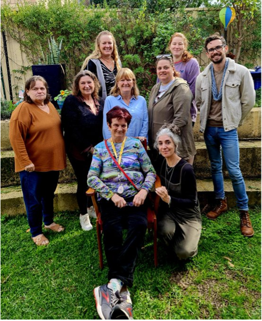 A group of people gathering for a photo
