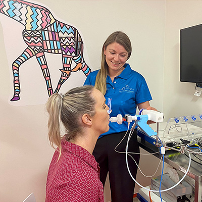 two people using an ecomedics exhalyzer device